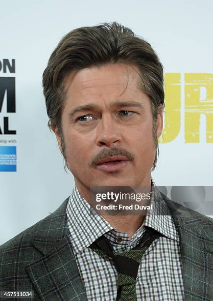 Brad Pitt attends a photocall for "Fury" during the 58th BFI London Film Festival at Corinthia Hotel London on October 19, 2014 in London, England.