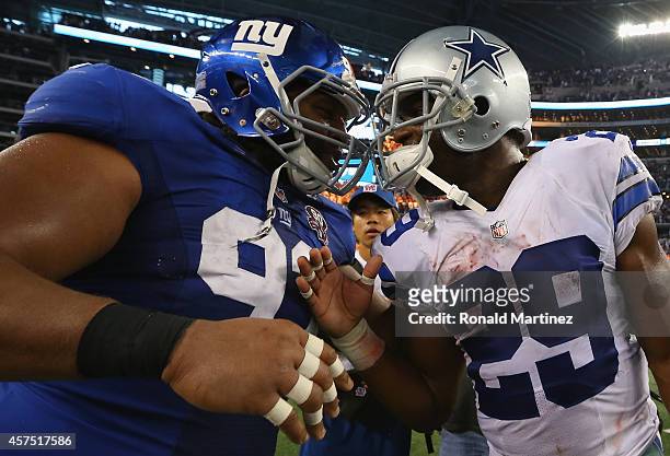 Mike Patterson of the New York Giants talks with DeMarco Murray of the Dallas Cowboys after a 31-21 win against the New York Giants at AT&T Stadium...