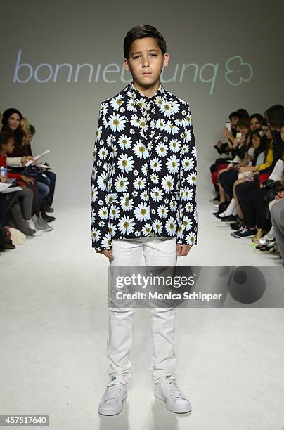 Kyah Cahill walks the runway during the Bonnie Young preview at petitePARADE / Kids Fashion Week at Bathhouse Studios on October 19, 2014 in New York...