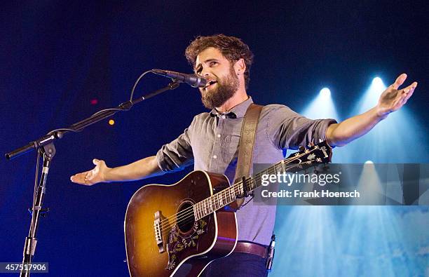 British singer Mike Rosenberg aka Passenger performs live during a concert at the Columbiahalle on October 19, 2014 in Berlin, Germany.