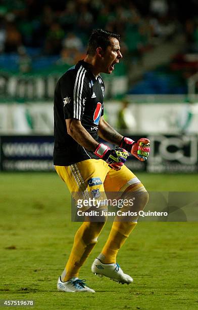 Luis Delgado, goalkeeper of Millonarios celebrates a scored goal during a match between Deportivo Cali and Millonarios as part of 15th round of Liga...