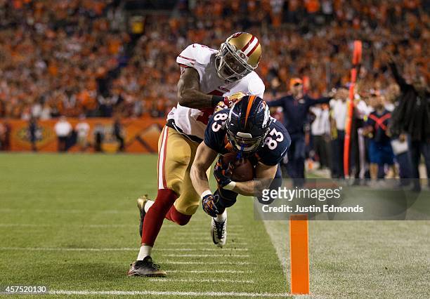 Wide receiver Wes Welker of the Denver Broncos is forced out of bounds at the goal line by strong safety Antoine Bethea of the San Francisco 49ers on...