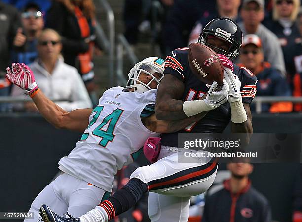 Cortland Finnegan of the Miami Dolphins breaks up a pass intended for Alshon Jeffery of the Chicago Bears at Soldier Field on October 19, 2014 in...