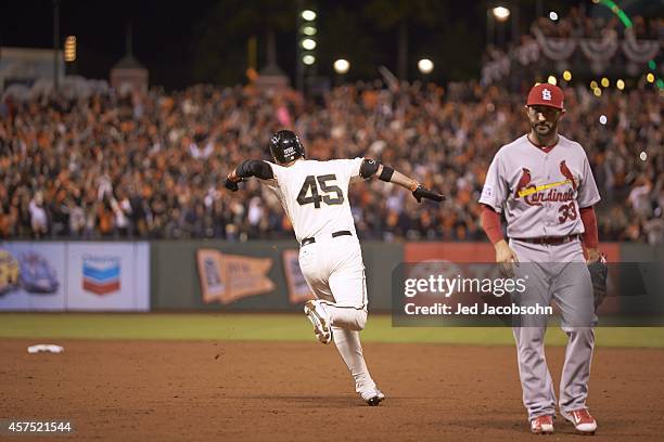 Playoffs: San Francisco Giants Travis Ishikawa victorious, running bases after hitting walk off home run to win Game 5 and series vs St. Louis...