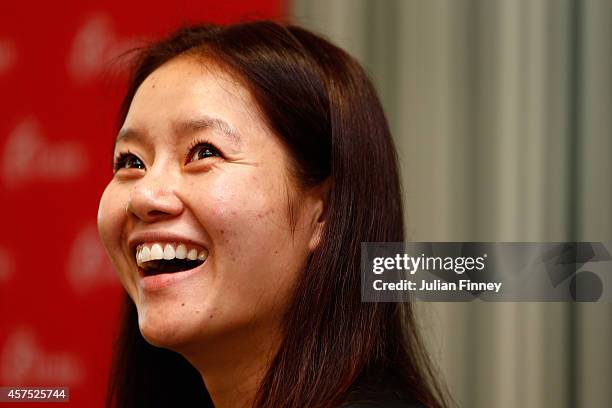 Li Na of China answers questions from local junior players during day one of the BNP Paribas WTA Finals tennis at the Singapore Sports Hub on October...