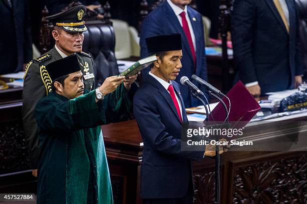 President Joko Widodo is sworn in during his inauguration ceremony at the House of Representative building on October 20, 2014 in Jakarta, Indonesia....