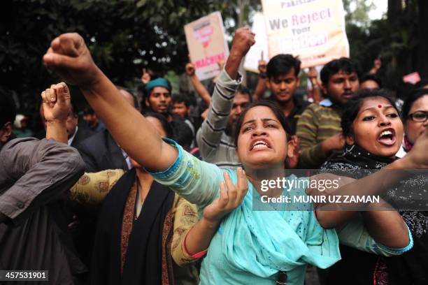 Bangladeshi social activists and bloggers chant slogans during a protest as they march towards the Pakistan High Commission in Dhaka on December 18,...