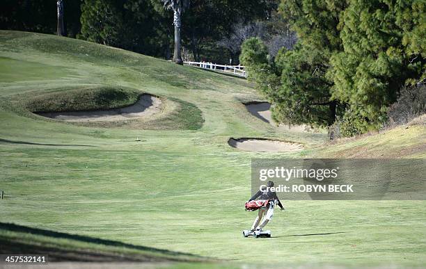 Former European tour player Chris van der Velde rides a GolfBoard up the fairway during a golf tournament at the Malibu Golf Club in Malibu,...