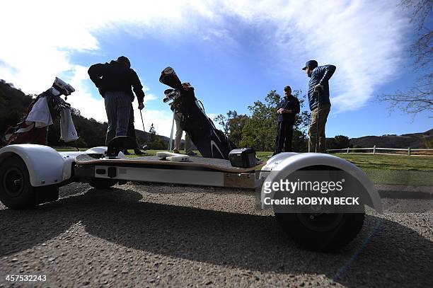 GolfBoard is seen beside the green during a golf tournament at the Malibu Golf Club in Malibu, California December 9, 2013.The innovative device that...