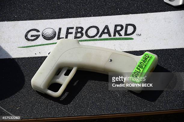 GolfBoard and it's handheld Bluetooth control are seen at the Malibu Golf Club in Malibu, California December 9, 2013. The innovative device that...