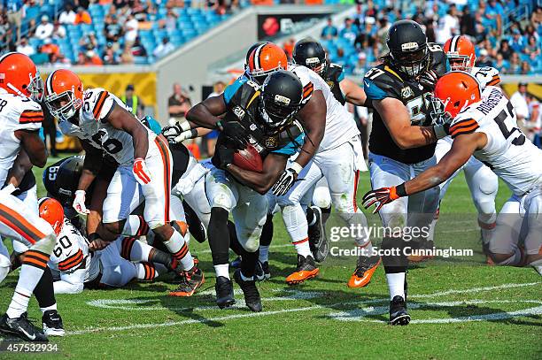 Denard Robinson of the Jacksonville Jaguars carries the ball against the Cleveland Browns at EverBank Field on October 19, 2014 in Jacksonville,...