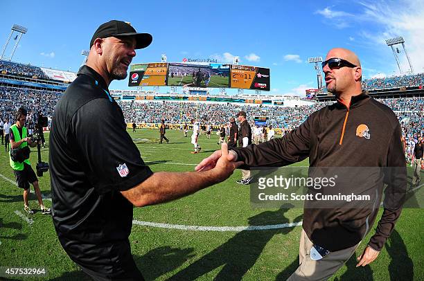 Head Coach Gus Bradley of the Jacksonville Jaguars is congratulated by Head Coach Mike Pettine of the Cleveland Browns after the game at EverBank...