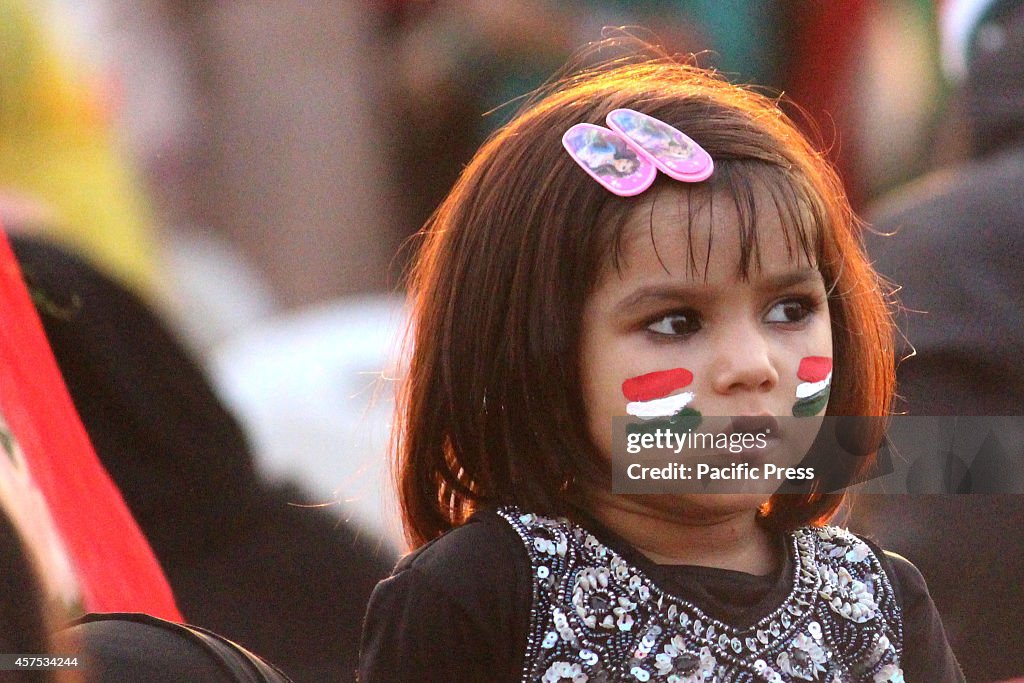 A child join the protest during the anti-government rally in...