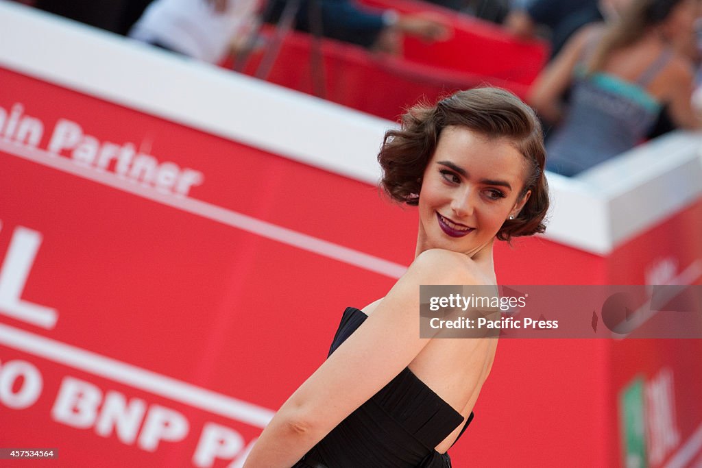 Lily Collins, cast of  "Love, Rosie" poses for a photograph...