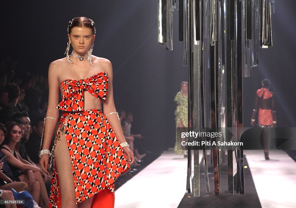 Models display a creation by Milin on the runway during the...