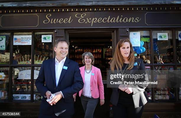 Prospective Conservative party candidates Anna Firth and Kelly Tolhurst emerge from a sweet shop with party Chairman Grant Shapps as they campaign...