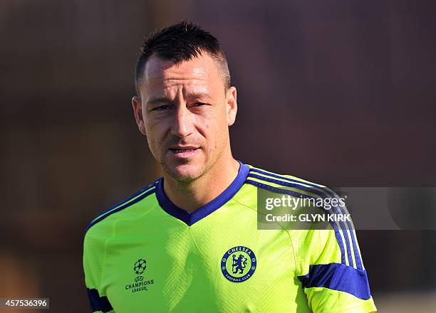 Chelsea's English defender John Terry attends a training session at Chelsea's training ground in the village of Stoke D'Abernon, south of London,...