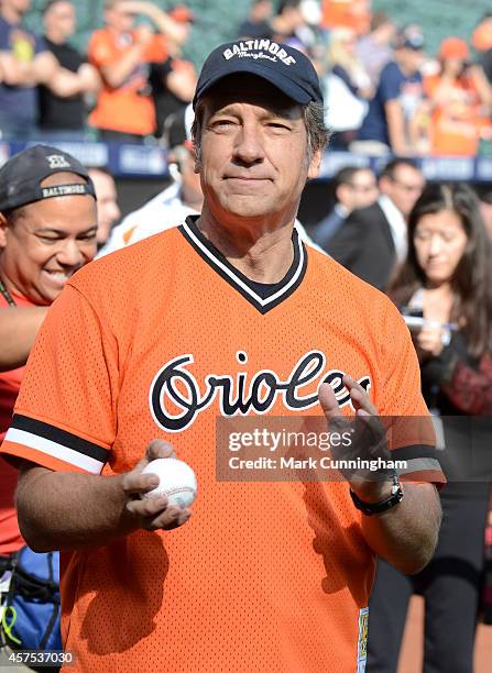 Mike Rowe, host of CNN's "Somebody's Gotta Do It," looks on during batting practice prior to Game Two of the American League Division Series between...