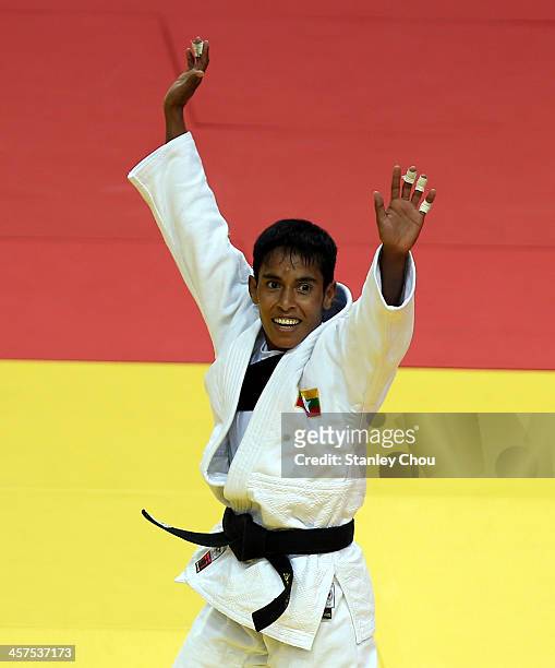 Sel Wee of Burma celebrates after she defeated Nacy Quillotes Lucero of the Philippines during the Final of the Women's 45 kg Judo Competition during...