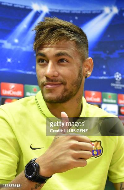 Barcelona's Brazilian forward Neymar da Silva Santos Junior gestures prior to a press conference at the Sports Center FC Barcelona Joan Gamper in...