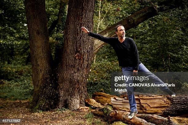 Tv presenter Nikos Aliagas and his wife Tina Grigoriou are photographed for Paris Match on October 10, 2014 in Paris, France.