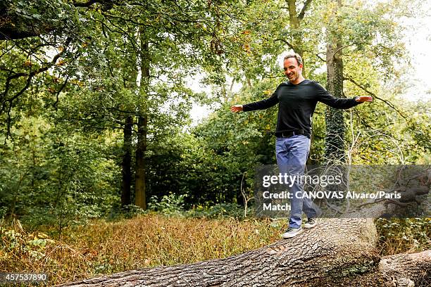 Tv presenter Nikos Aliagas and his wife Tina Grigoriou are photographed for Paris Match on October 10, 2014 in Paris, France.