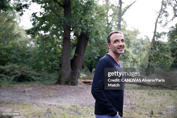 Tv presenter Nikos Aliagas and his wife Tina Grigoriou are photographed for Paris Match on October 10, 2014 in Paris, France.