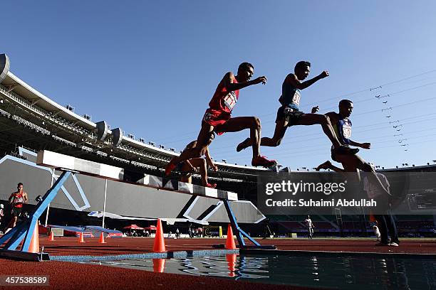 Patikarn Pechsricha of Thailand, Christoper Jr Ulboc of Philippines and Rene Herrera of Philippines compete in the men's 3000m steeplechase final...