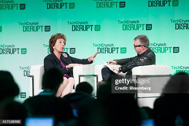 Neelie Kroes, member of the European Commission in charge of the development of online markets, left, speaks during a panel session at the Disrupt...