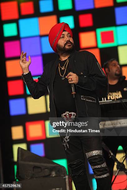Indian playback singer Daler Mehandi performs during Hum Hain.. Ummeed-e-Kashmir concert at Indira Gandhi Stadium on October 18, 2014 in New Delhi,...