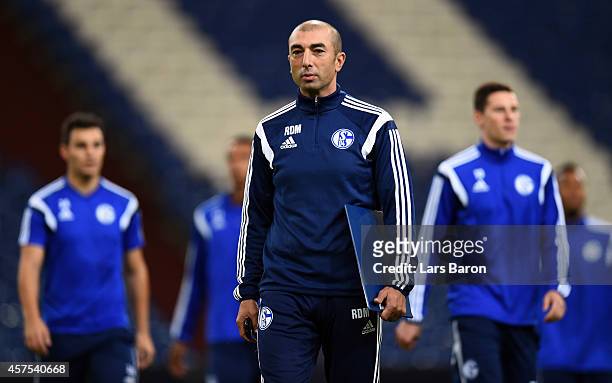 Head coach Roberto di Matteo looks on during a FC Schalke 04 training session ahead of their Champions League match against Sporting Clube de...