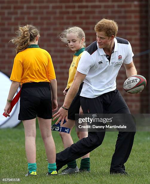 Prince Harry, Patron of England Rugby's All Schools Programme, plays touch rugby against schoolchildren during a teacher training session at Eccles...