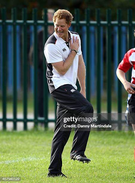 Prince Harry, Patron of England Rugby's All Schools Programme, plays touch rugby against schoolchildren during a teacher training session at Eccles...