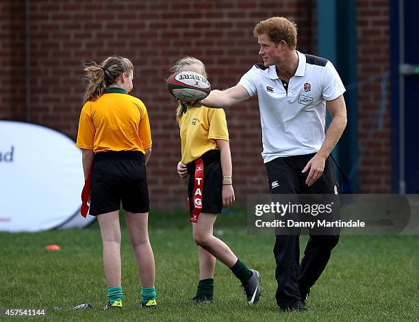 Prince Harry, Patron of England Rugby's All Schools Programme, plays touch rugby against schoolchildren during a teacher training session at Eccles...