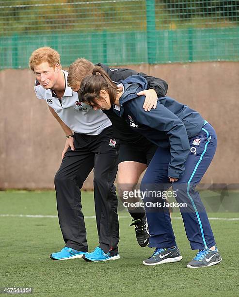 Prince Harry, Patron of England Rugby's All Schools Programme, takes part in a rugby training session with England women's rugby player Sarah Hunter...