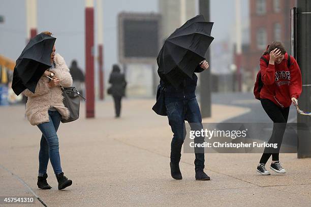 Students brave high winds and rain on Blackpool promenade as Britain prepares for high winds over the next two days on October 20, 2014 in Blackpool,...