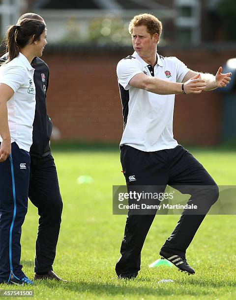 Prince Harry, Patron of England Rugby's All Schools Programme, jokes with Sarah Hunter as he plays touch rugby against schoolchildren during a...