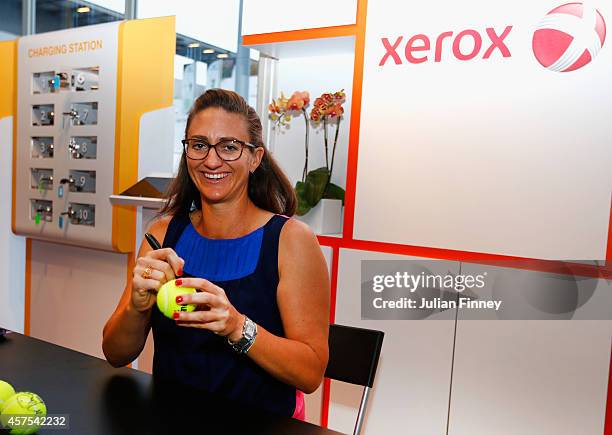 Ex player Mary Pierce visits the Xerox fans booth during day one of the BNP Paribas WTA Finals tennis at the Singapore Sports Hub on October 20, 2014...