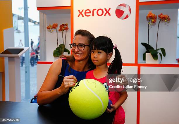 Ex player Mary Pierce visits the Xerox fans booth during day one of the BNP Paribas WTA Finals tennis at the Singapore Sports Hub on October 20, 2014...