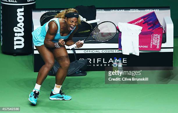 Serena Williams of the United States celebrates a point during her straight sets victory against Ana Ivanovic of Serbia in their round robin match of...