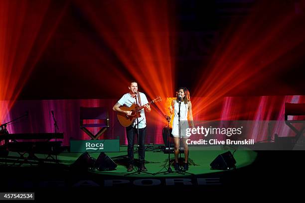 Entertainers sing at the opening ceremony prior to the start of the opening round robin match of the BNP Paribas WTA Finals at Singapore Sports Hub...