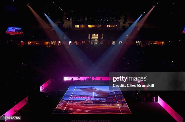 Spotlights light up the court as images are projected on to the court surface at the opening ceremony prior to the start of the opening round robin...