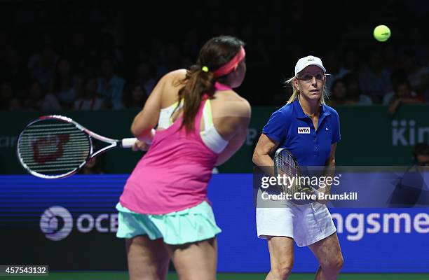 Martina Navratilova of the United States and Marion Bartoli of France in action on their way to victory against Tracy Austin of the United States and...