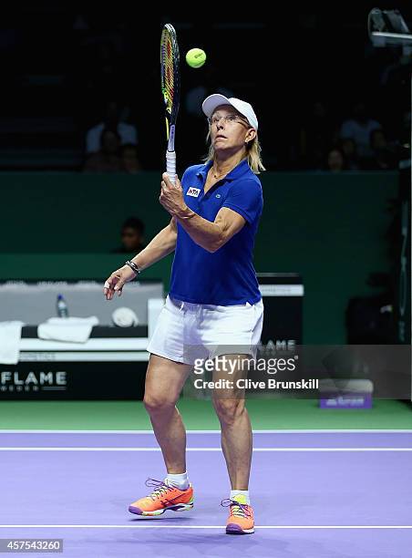 Martina Navratilova of the United States in action on her way to victory against Tracy Austin of the United States and Iva Majoli of Croatia in the...