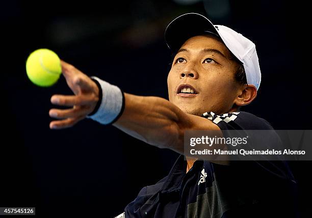 Yen-Hsun Lu of Taipei serves to Guillermo Garcia-Lopez of Spain during day one of the ATP 500 World Tour Valencia Open tennis tournament at the...