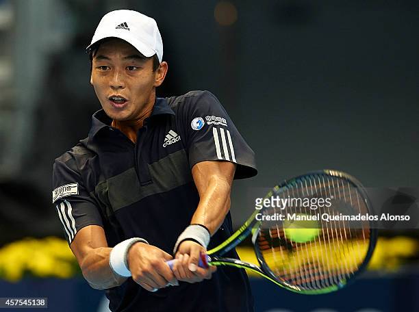 Yen-Hsun Lu of Taipei returns a shot against Guillermo Garcia-Lopez of Spain during day one of the ATP 500 World Tour Valencia Open tennis tournament...
