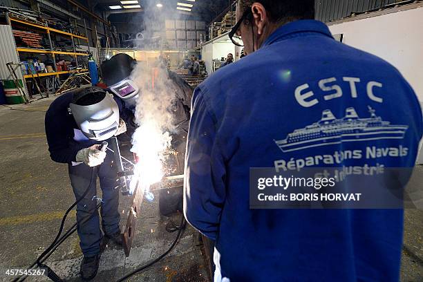 Entreprise Soudure Tuyauterie Chaudronnerie company's employees work for the Societe Nationale Corse Mediterrannee on boat pieces, on December 18,...