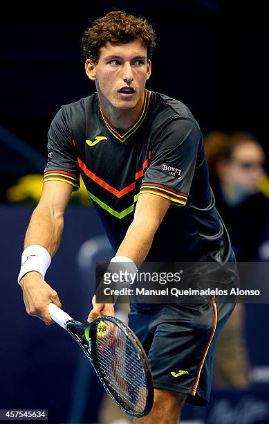 Pablo Carreno Busta of Spain serves to Marcel Granollers of Spain during day one of the ATP 500 World Tour Valencia Open tennis tournament at the...
