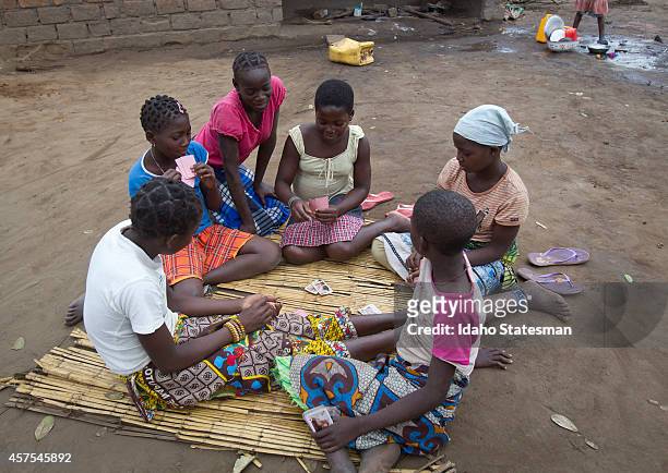 Girls play cards in the community of Vinho, the closet village to Gorongosa National Park.