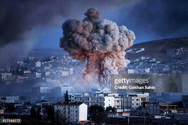 An explosion rocks Syrian city of Kobani during a reported suicide car bomb attack by the militants of Islamic State group on a People's Protection...